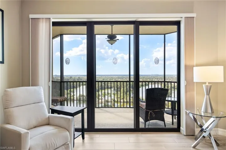 Living room looking straight out unto lanai and beauty views of Lakes Park.