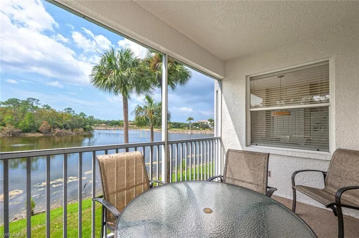 Sunroom with a water view