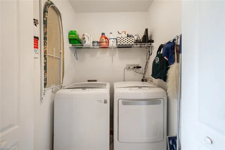 Washroom featuring washing machine and clothes dryer