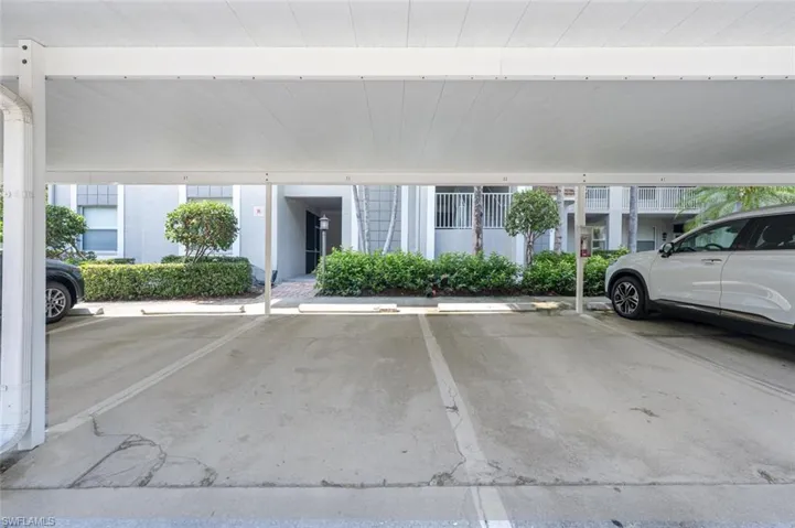 View of vehicle parking with a carport