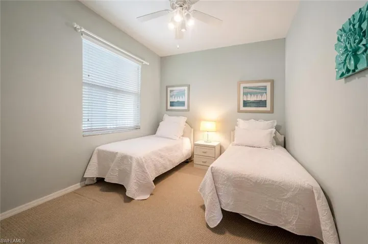 Bedroom featuring ceiling fan and light colored carpet