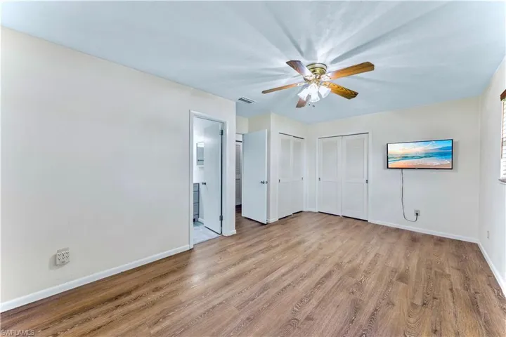 Spare room featuring ceiling fan and light hardwood / wood-style floors