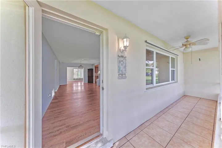 Property entrance featuring ceiling fan