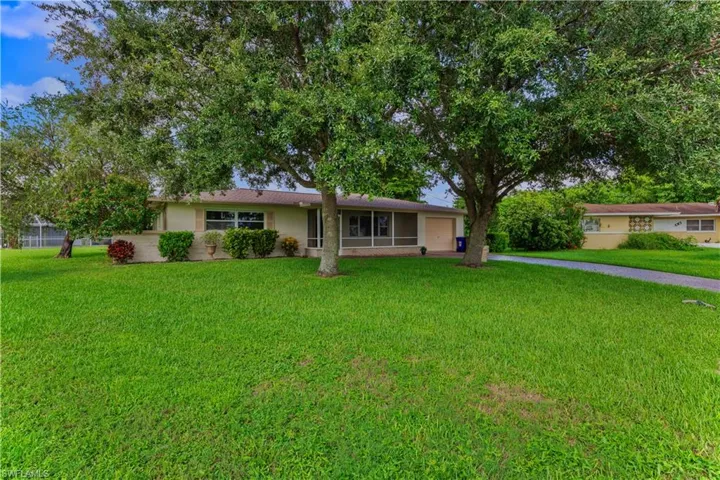 Ranch-style home with a front lawn