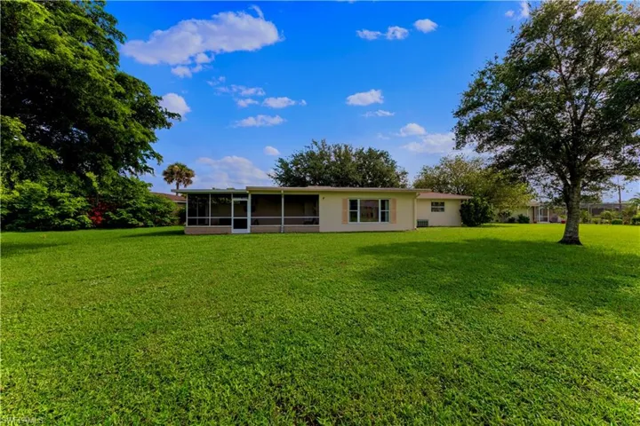 View of yard featuring a sunroom