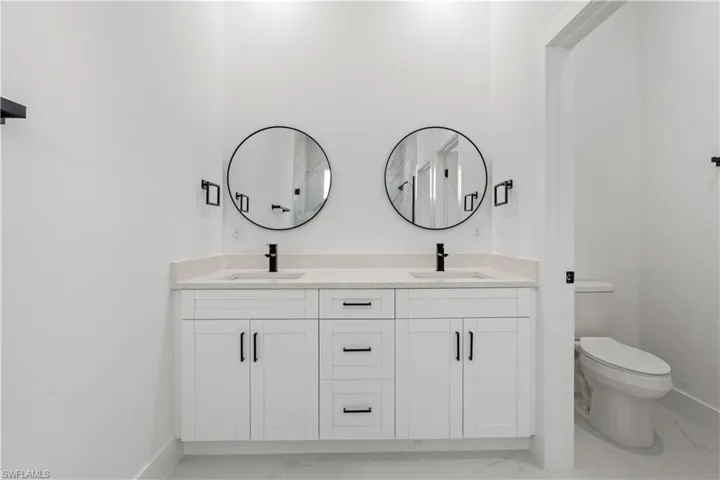 Bathroom with vanity and toilet