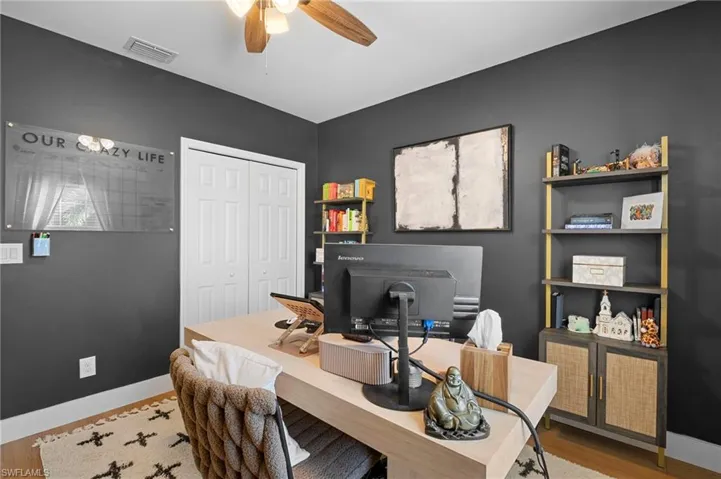 Office featuring ceiling fan and wood finished floors