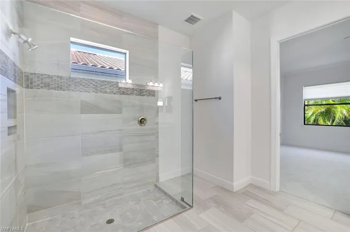 Frameless Walk-In Shower with Floor-to-Ceiling Tile