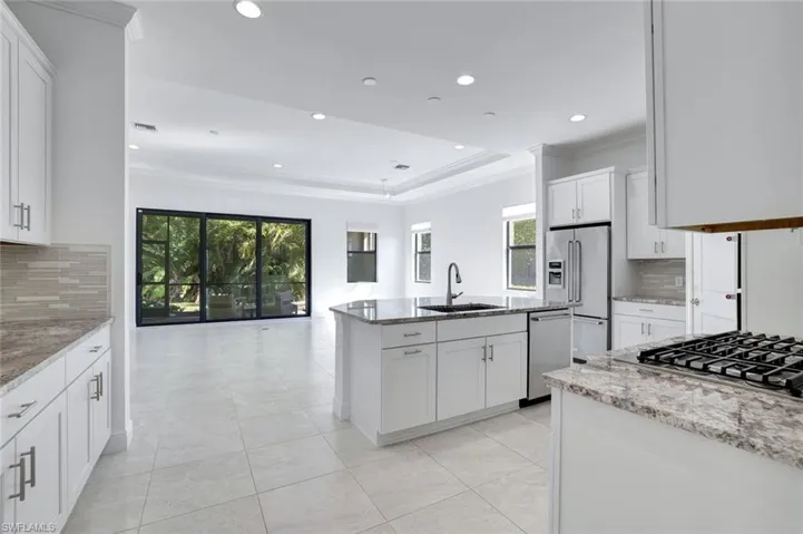 Spacious Kitchen with Granite Countertops and Walk-In Pantry