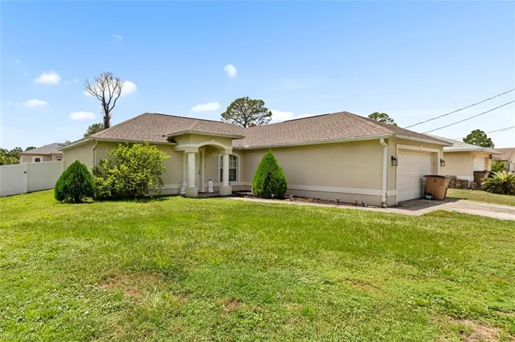 Ranch-style home featuring a garage, stucco siding, concrete driveway, and a shingled roof