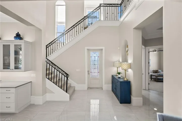 View of the front door and stairway