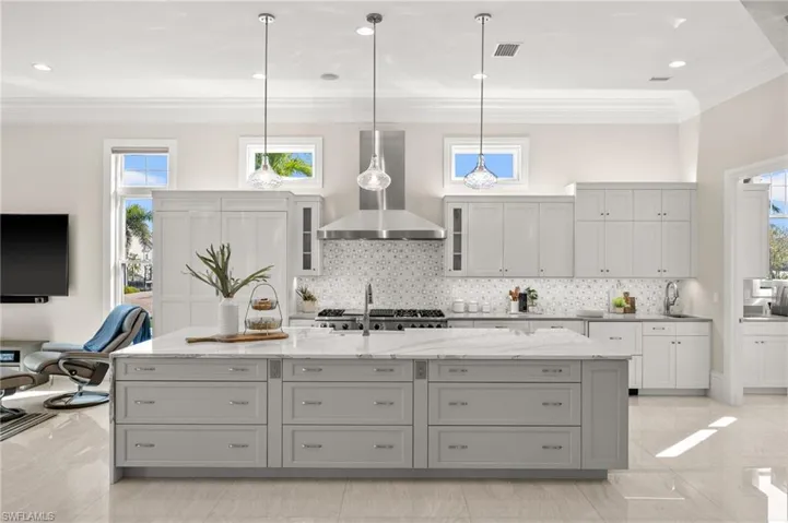 Custom cabinets galore in the bright and airy kitchen