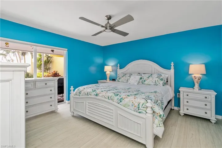 The SPACIOUS MASTER BEDROOM includes WALK-IN CLOSETS & SLIDING DOORS TO THE SCREENED PATIO!