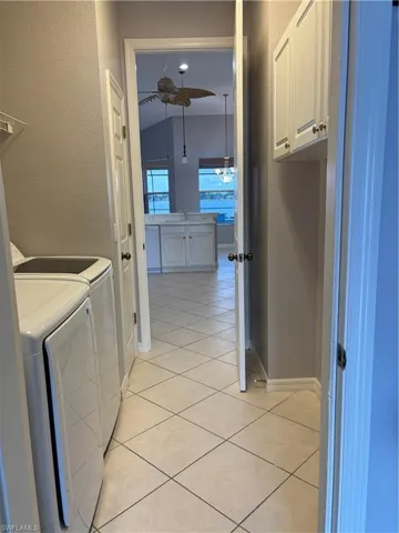 Garage entrance to the Laundry room featuring New Washer and New Dryer