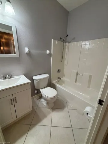 Bathroom featuring bathtub / shower combination, new vanity and mirror