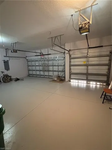 Garage featuring a garage door opener