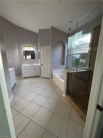 Spacious primary bathroom includes a linen closet