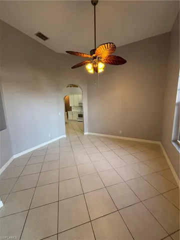 Separate Dining room with arched entrance into the kitchen