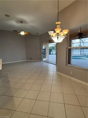 Another angle of the breakfast and family room areas with a view of the pool and lake.
