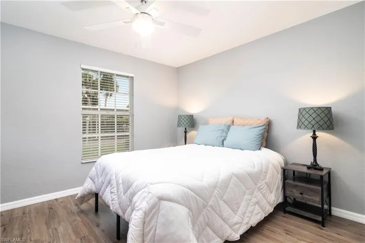 Bedroom with wood finished floors and a ceiling fan