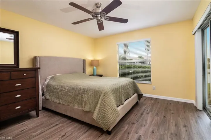 Bedroom with wood finished floors and ceiling fan