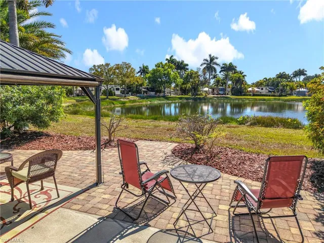 View of patio with a water view