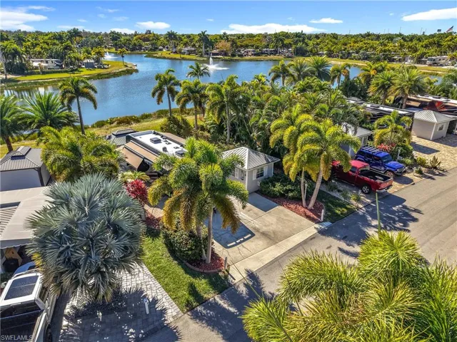 Bird's eye view of a nearby body of water and a tree filled landscape