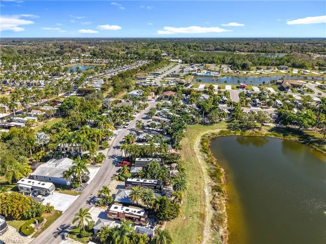 Aerial overview of property's location with a nearby body of water and nearby suburban area