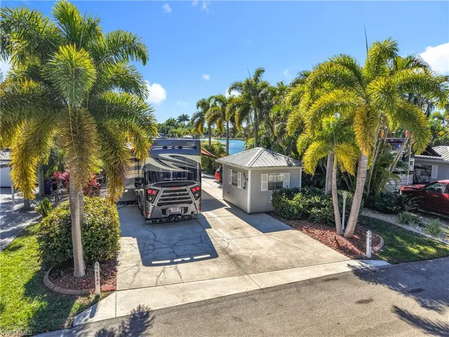View of vehicle parking with concrete driveway