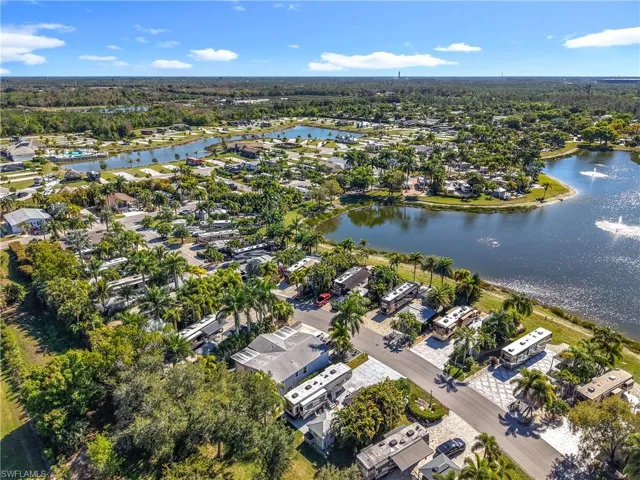 Aerial overview of property's location with a large body of water and nearby suburban area