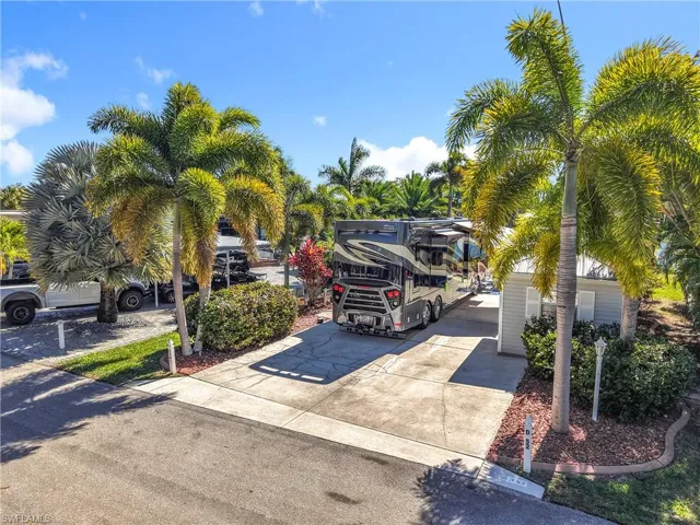 View of car parking featuring driveway