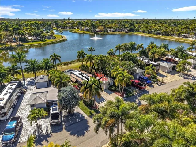 Bird's eye view of a nearby body of water and a tree filled landscape