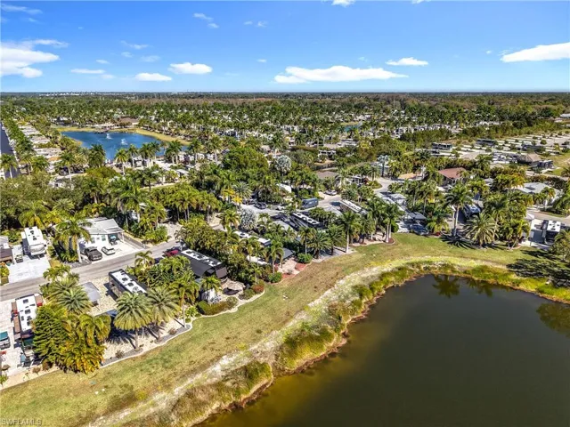 Aerial overview of property's location with nearby suburban area and a large body of water