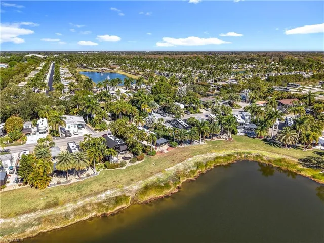 Aerial view of property's location with nearby suburban area and a nearby body of water