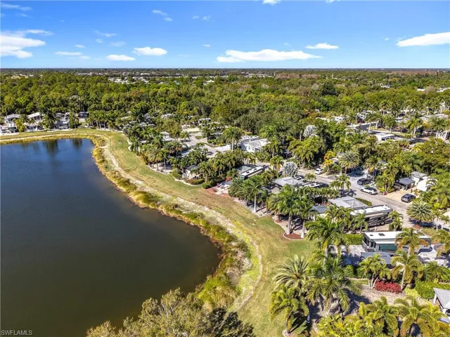 View of property location featuring a nearby body of water and nearby suburban area