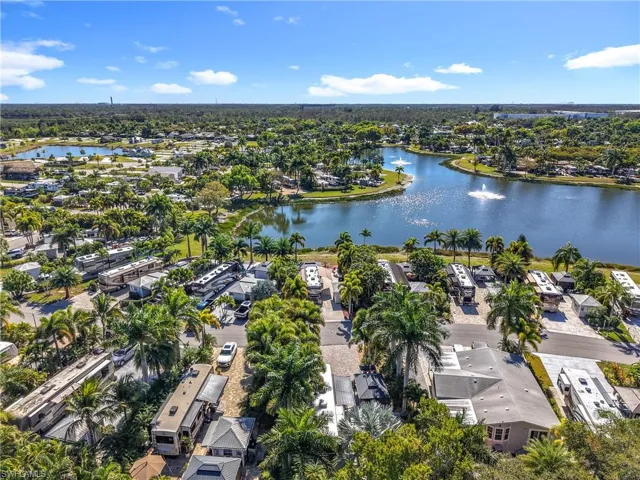 View of property location featuring a large body of water and nearby suburban area