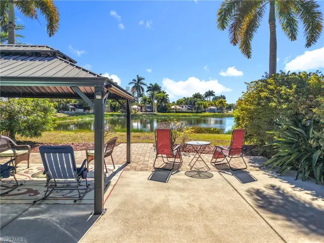 View of patio with a water view