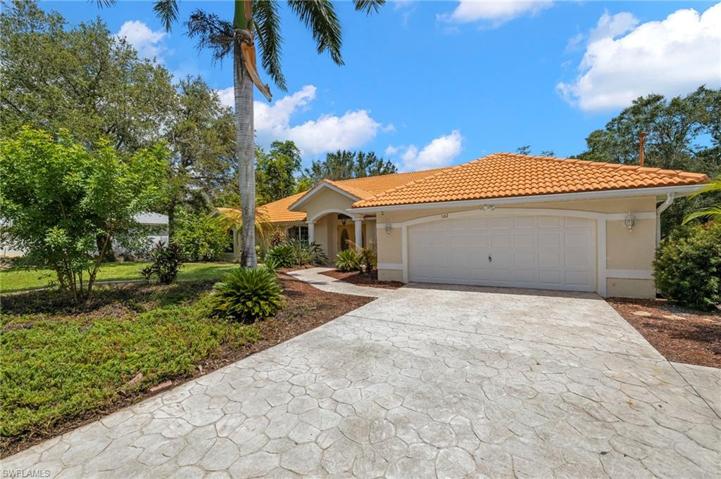 Front of home featuring stamped driveway