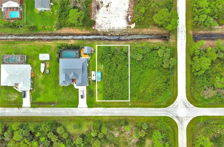 Aerial overview of property's location with property parcel outlined