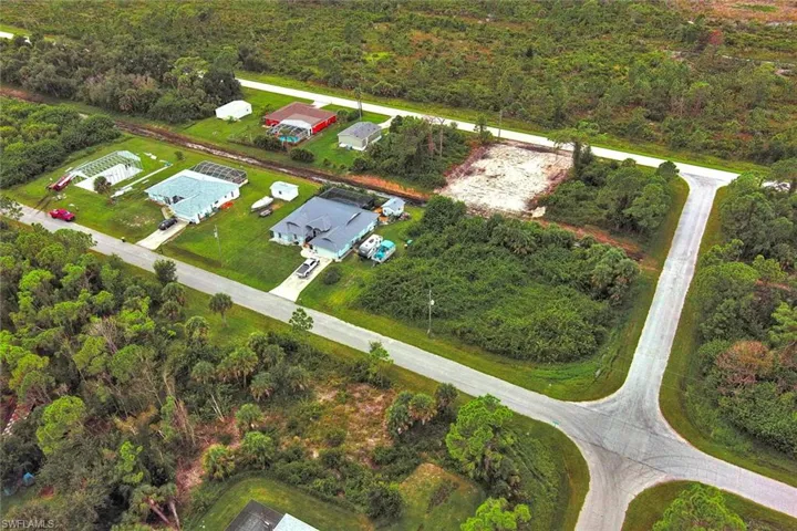 View of property location featuring a forest