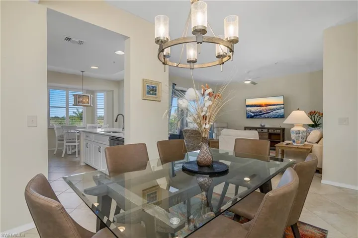 Dining space featuring visible vents, an inviting chandelier, light tile patterned flooring, baseboards, and recessed lighting