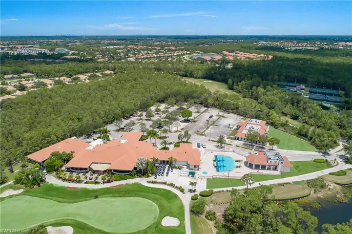 Bird's eye view with view of golf course and a water view