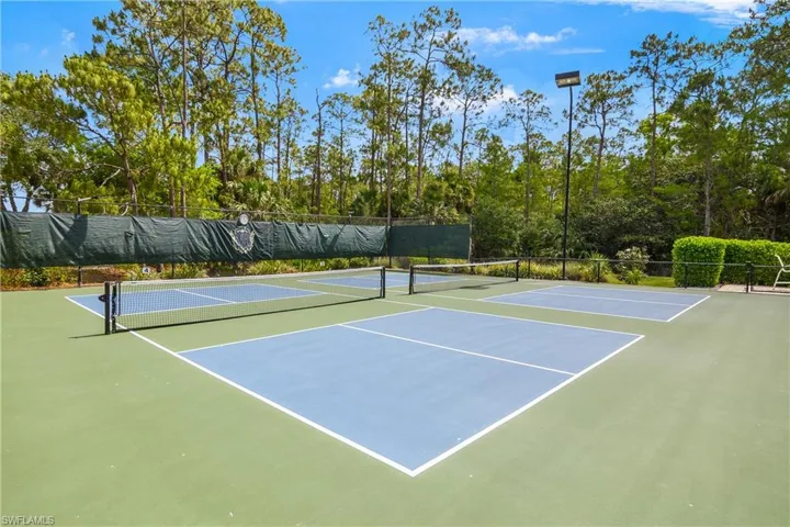 View of sport court featuring fence and community basketball court