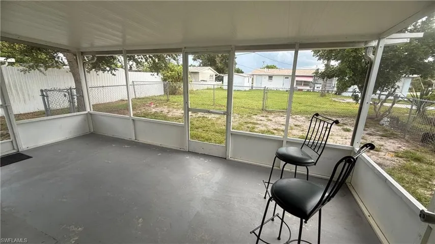 Unfurnished sunroom featuring plenty of natural light
