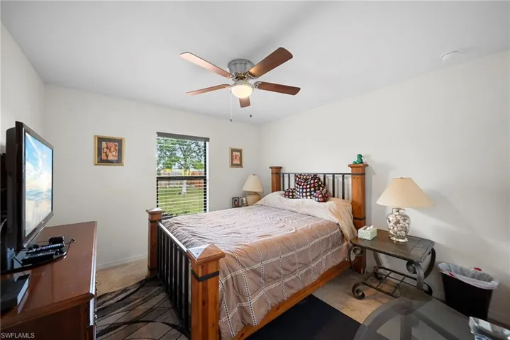 Bedroom with carpet flooring and ceiling fan