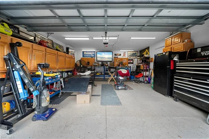 Garage with freestanding refrigerator
