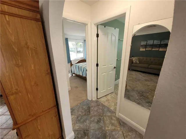 Hall featuring baseboards