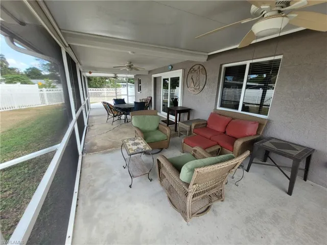 Sunroom / solarium with a ceiling fan, an outdoor hangout area, and outdoor dining space