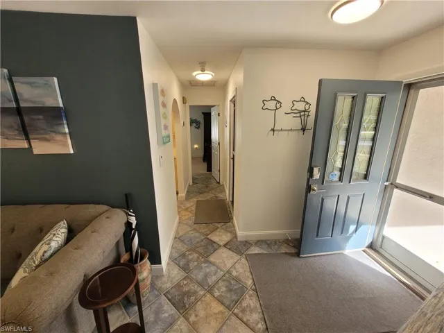 Entrance foyer featuring baseboards