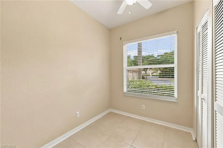 Neutral-toned walls complement the tiled flooring